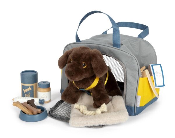 Hund mit Tasche und Pflege-Set